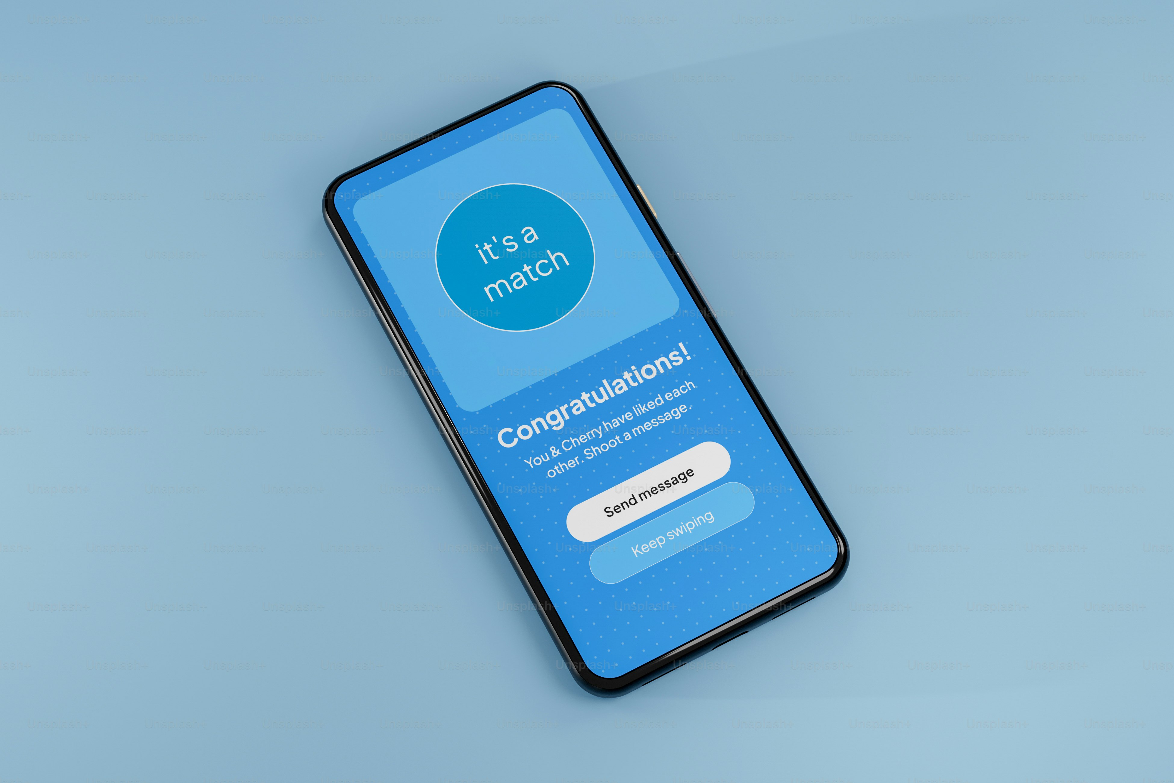A cell phone sitting on top of a blue surface